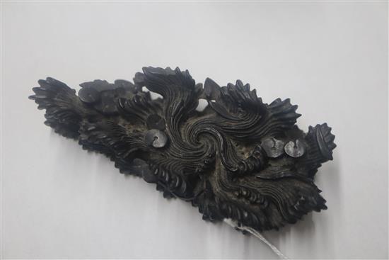 A Chinese rosewood stand, 19th century, carved as waves width 12cm